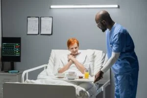 Nursing Careers 4 Business Services and Staffing Solutions - Nursing, Mine Services, Remote Digital Confined Space Monitoring, Alberta trucking, alberta transportation services, oil and gas Nurse bringing breakfast for patient