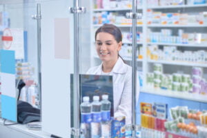 At work. Female pharmacist working in a drugstore