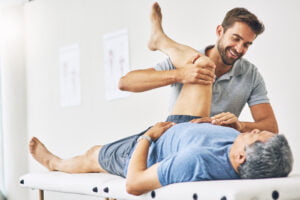 Thats good. Cropped shot of a young male physiotherapist assisting a senior patient in recovery
