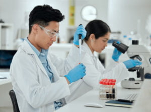 Time to send this off to the lab. Shot of a young man filling a test tube in a lab